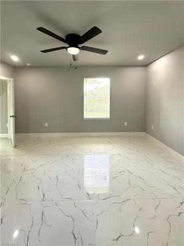 Spare room featuring ceiling fan