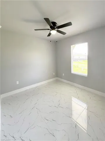 Unfurnished room with ceiling fan