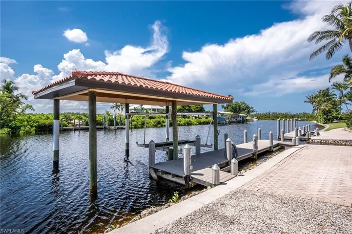Dock featuring a water view and boat lift