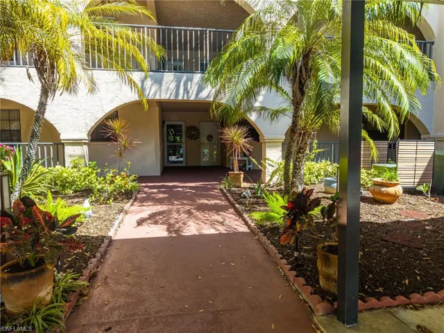Entrance to property with stucco siding
