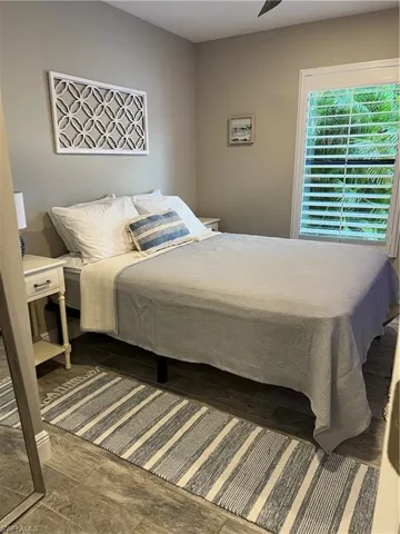 Bedroom featuring a ceiling fan and wood finished floors
