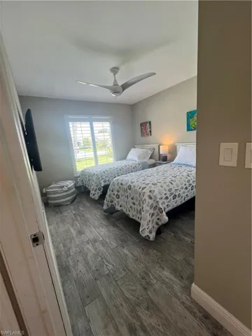 Guest bedroom with twin beds and fan
