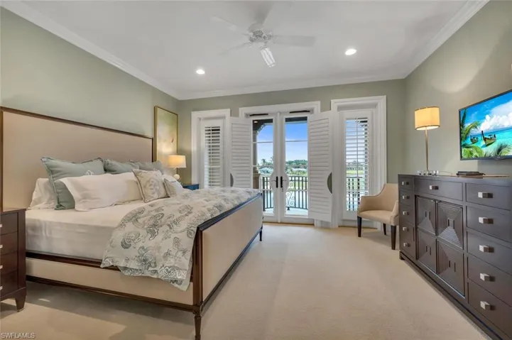 Bedroom featuring french doors, access to exterior, light colored carpet, ceiling fan, and recessed lighting