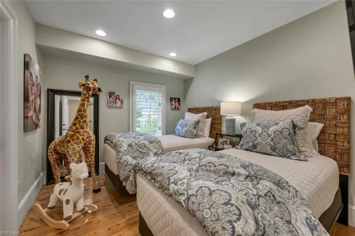 Bedroom featuring light wood-style flooring and recessed lighting