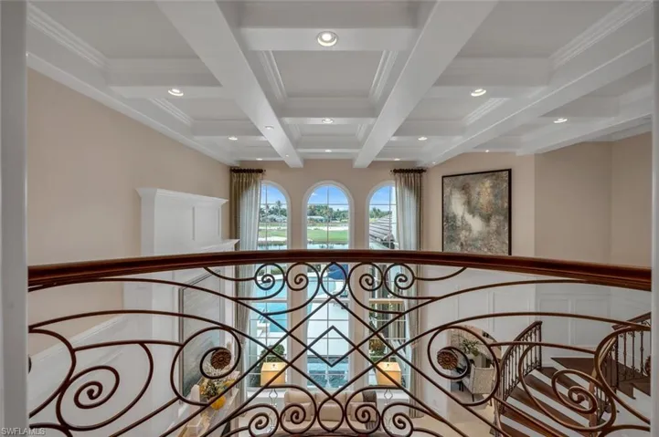 Detailed view of beamed ceiling, coffered ceiling, recessed lighting, and crown molding
