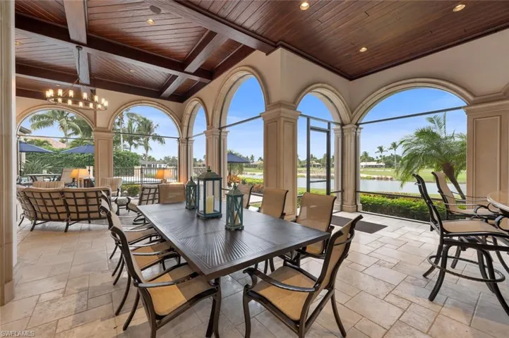 View of patio with outdoor dining space and a water view