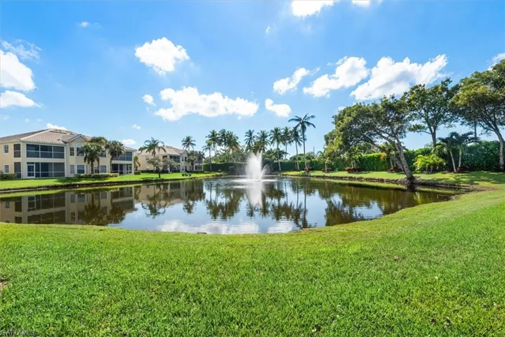 condo situated on small lake with water fountain