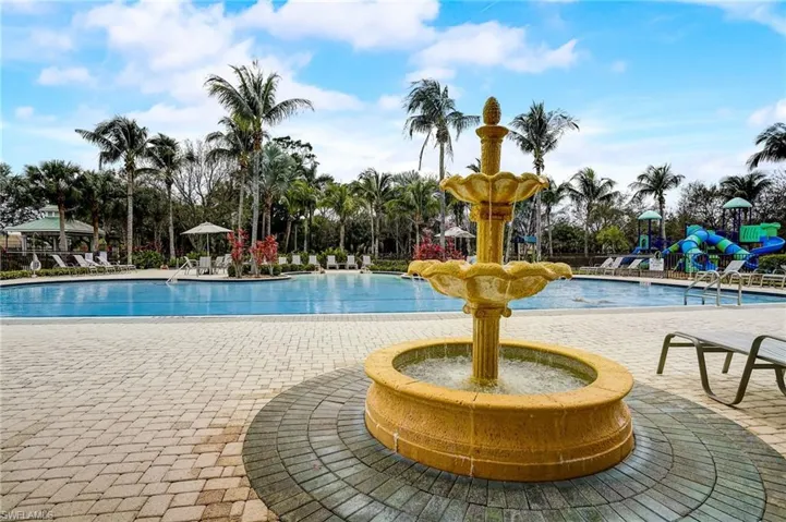 View of swimming pool with a playground