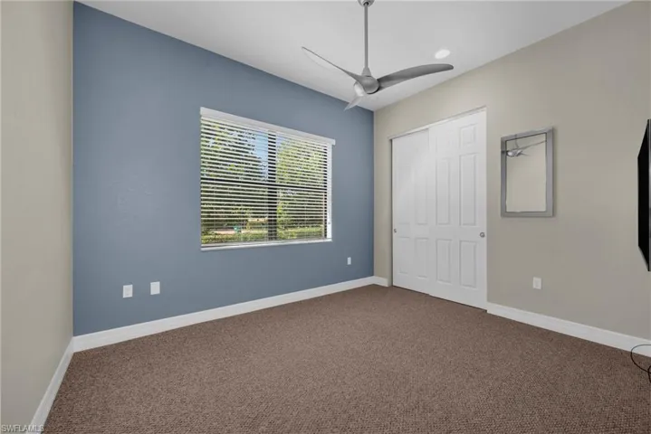 Versatile room ideal as a third bedroom, den, or home office with natural light.