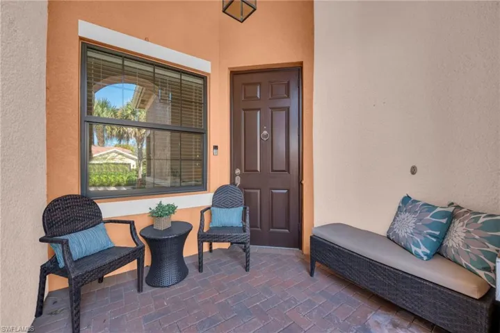 Covered entry porch offering a welcoming space to relax and unwind.