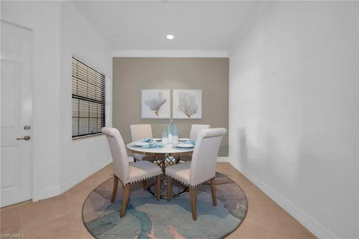 Light-filled dining area with neutral finishes and an open, airy feel.