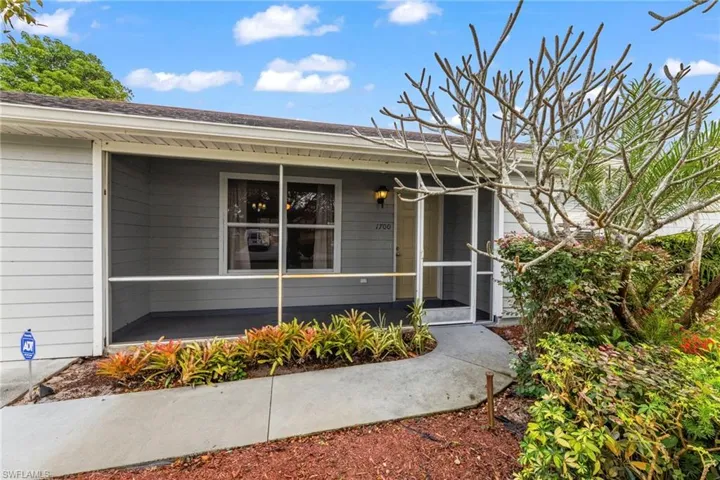 Entrance to property featuring a porch