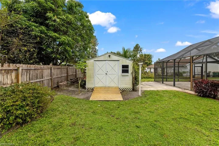 View of shed featuring a fenced backyard