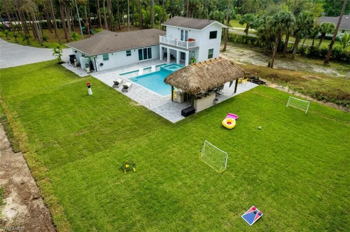 View from above of property with a pool area