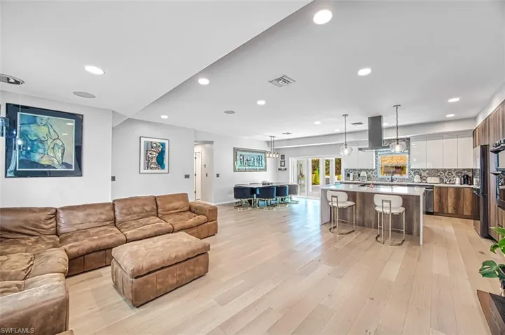 Living room featuring recessed lighting and light wood-type flooring