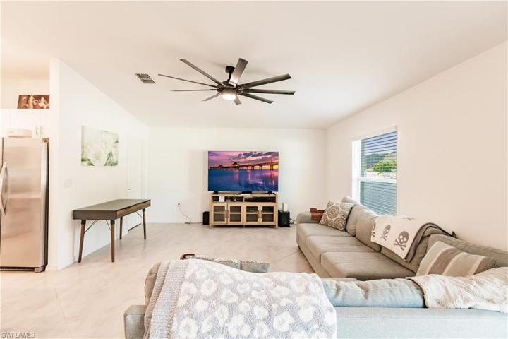 Simple & neutral tiled floors throughout your open living space.