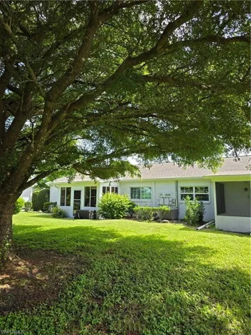 Single story home with a front yard