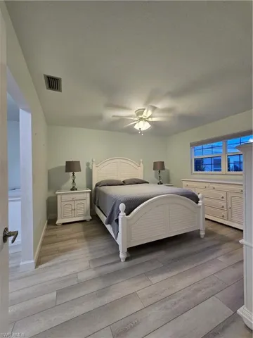 Bedroom featuring ceiling fan and light wood-type flooring