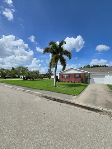 View of front of property with a front yard