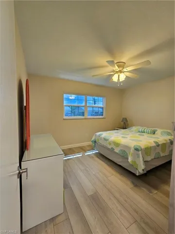 Bedroom featuring light wood-type flooring and ceiling fan
