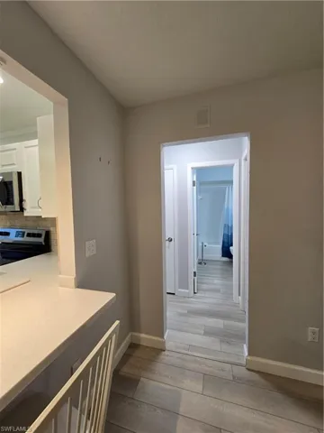 Corridor featuring light hardwood / wood-style floors