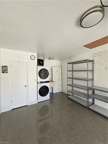 Garage with stacked washing maching and dryer