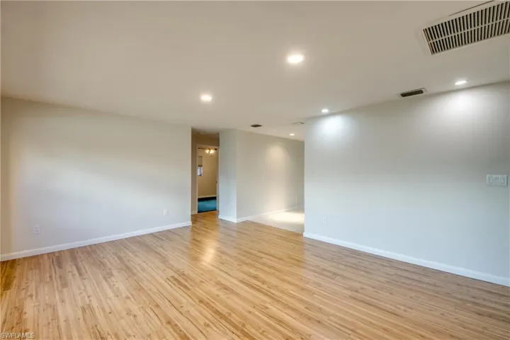 Spare room with recessed lighting and light wood-type flooring