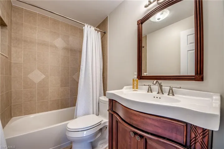 Full bathroom with vanity and shower / bath combo