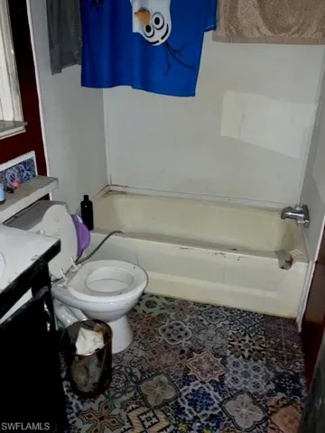 Full bathroom with vanity, toilet, and shower / bath combination