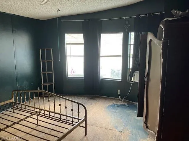 Bedroom featuring a textured ceiling