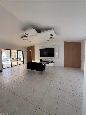 Living area with light tile patterned floors