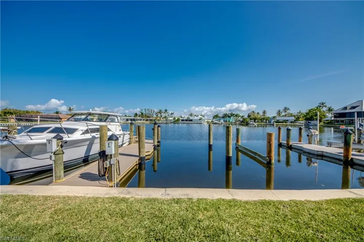 Dock area featuring a water view