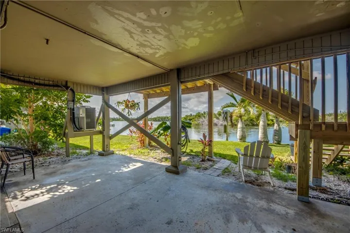View of patio / terrace with a water view and stairway
