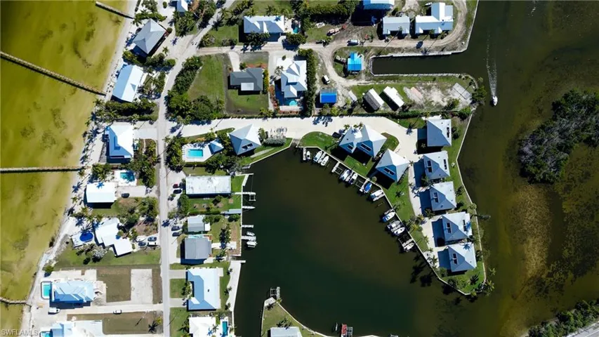 Aerial view with a water view and a residential view