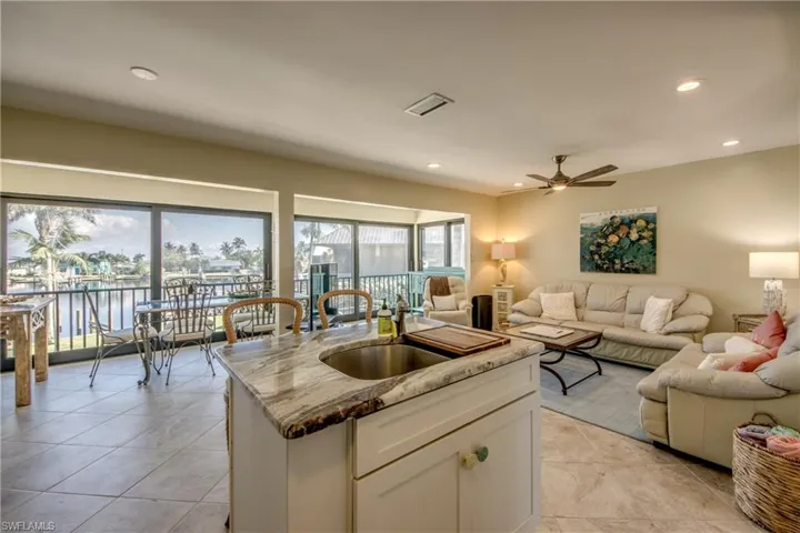Kitchen with visible vents, open floor plan, a sink, and recessed lighting