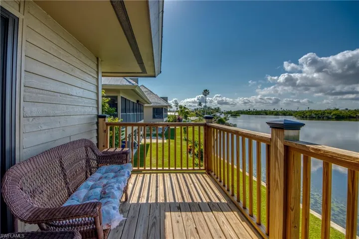 Wooden deck featuring a water view