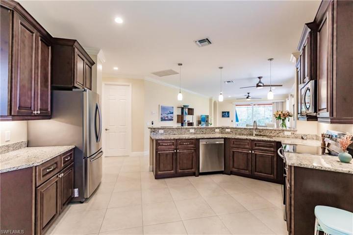 AMAZING KITCHEN WITH 3 SEPARATE COUNTERTOPS & TONS OF HIGH QUALITY CABINETS!