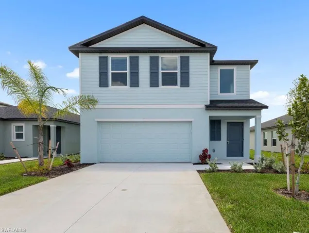 Stunning two-story home featuring a modern coastal exterior with fresh landscaping, a paved two-car driveway and an attached two-car garage. Brand new construction with great curb appeal in the heart of Crane Landing.