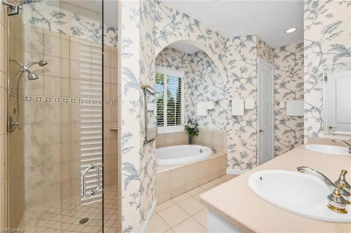 Such a delightful bathroom. Door goes out to screened-in courtyard area.