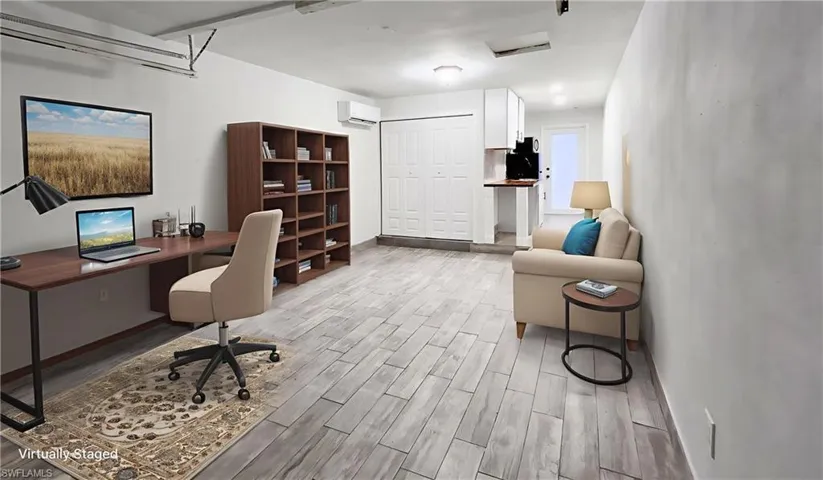 Office featuring wood tiled floors and a wall mounted mini split