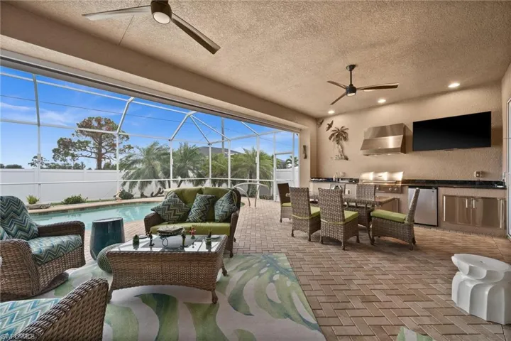 The lanai has an outdoor kitchen and plenty of living space