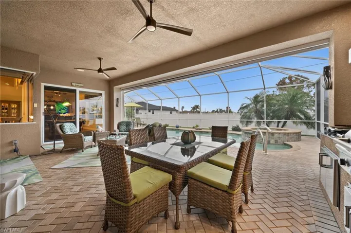 Under cover lanai is large and spacious, and even has an automatic storm screen