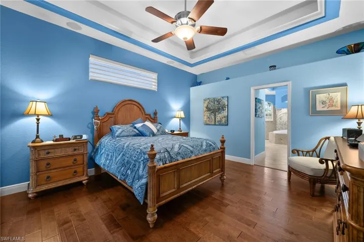 Master bedroom has tray ceilings with uplighting