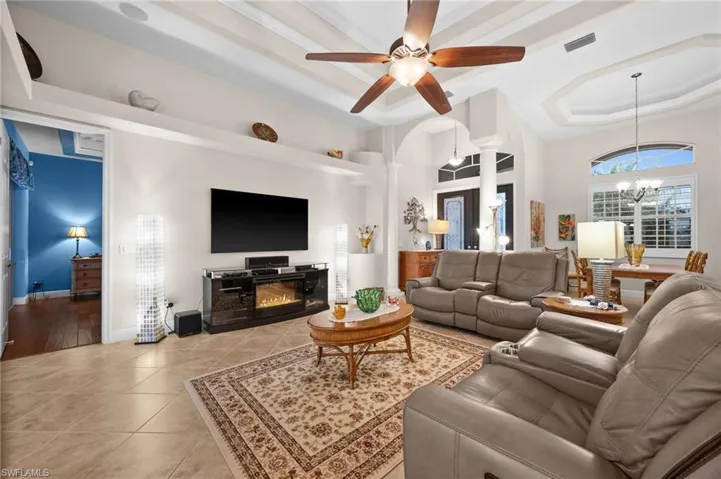Large and open living room with tray ceiling