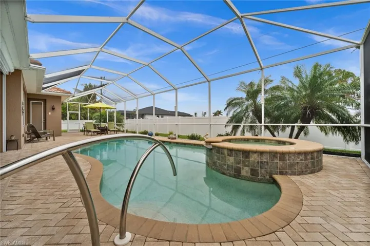 The large heated saltwater pool and spa