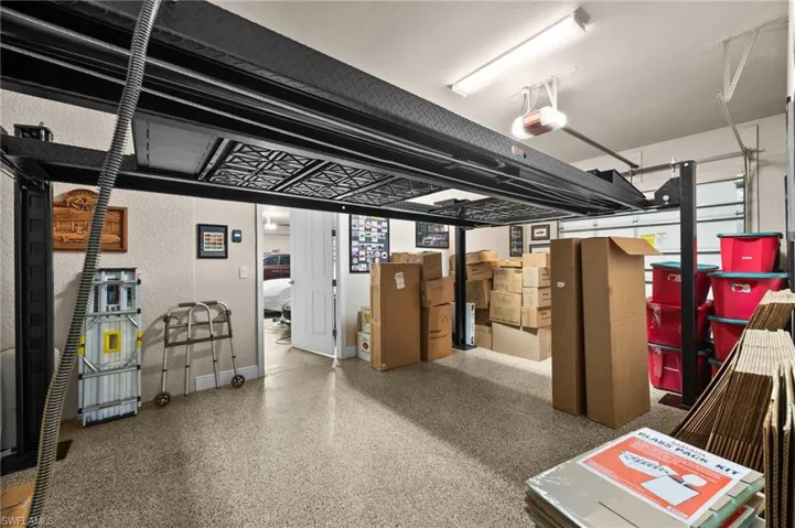 Fifth garage space has a lift for working on your car