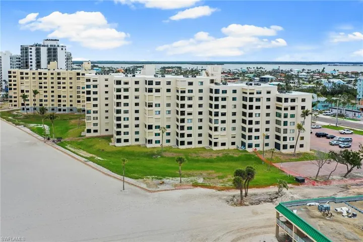 View of building exterior featuring a view of city and a water view
