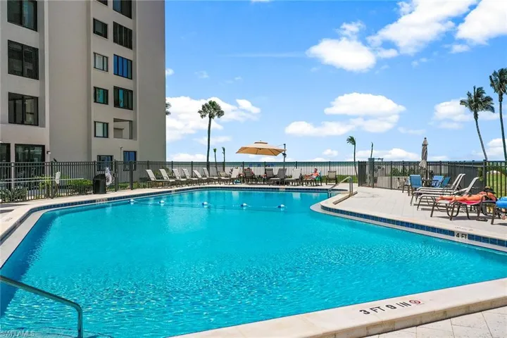 Community pool with a patio area
