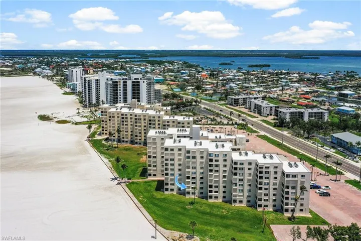 View of urban area with a nearby body of water and apartment complex / building