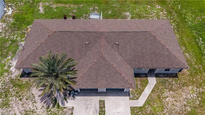 Expansive shingle roofline with multiple gables